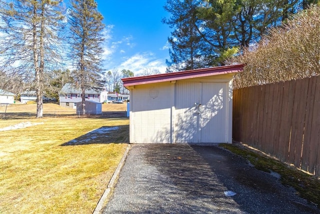 view of shed with fence