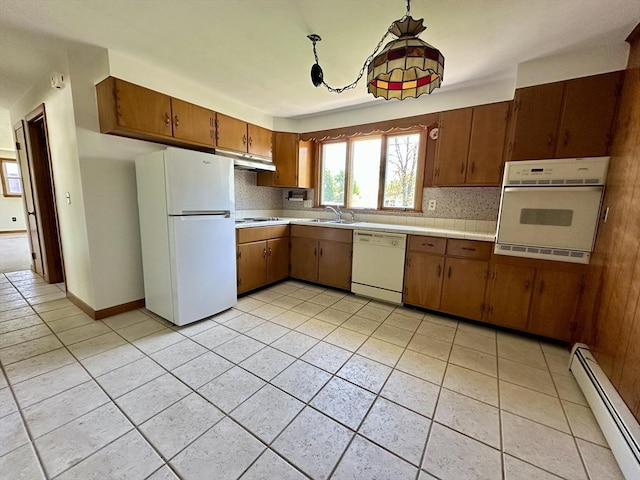 89 Napoleon Ave, Ludlow, MA 01056 - kitchen with white appliances, a baseboard heating unit, light tile patterned floors, brown cabinetry, and tasteful backsplash