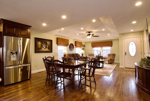 dining room featuring ceiling fan and dark wood-type flooring