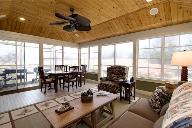 living room with ceiling fan, wood ceiling, and light wood-type flooring