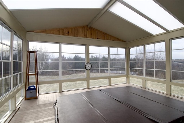 unfurnished sunroom featuring lofted ceiling