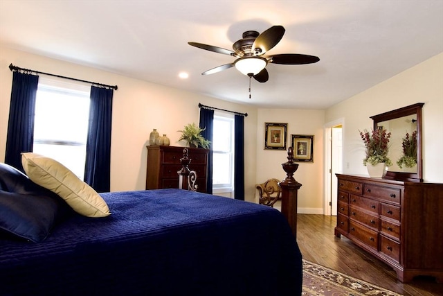 bedroom featuring ceiling fan and dark hardwood / wood-style flooring