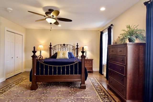 bedroom featuring ceiling fan, a closet, and wood-type flooring