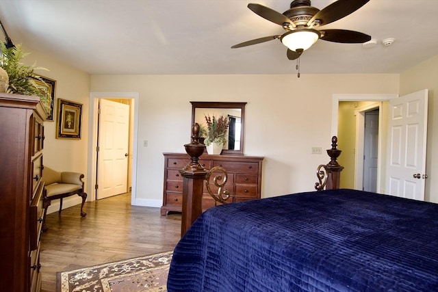 bedroom featuring ceiling fan and dark wood-type flooring