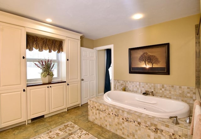 bathroom featuring tiled bath