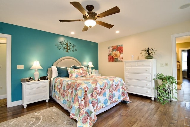 bedroom with ceiling fan and dark hardwood / wood-style floors