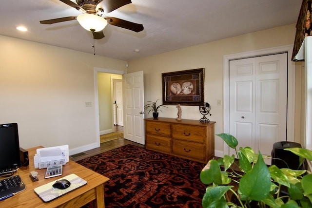 interior space featuring ceiling fan and dark hardwood / wood-style floors