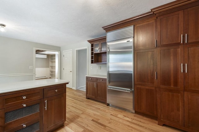 3 Howe St, Medway, MA 02053 - kitchen with built in refrigerator, light wood-type flooring, light countertops, open shelves, and a textured ceiling