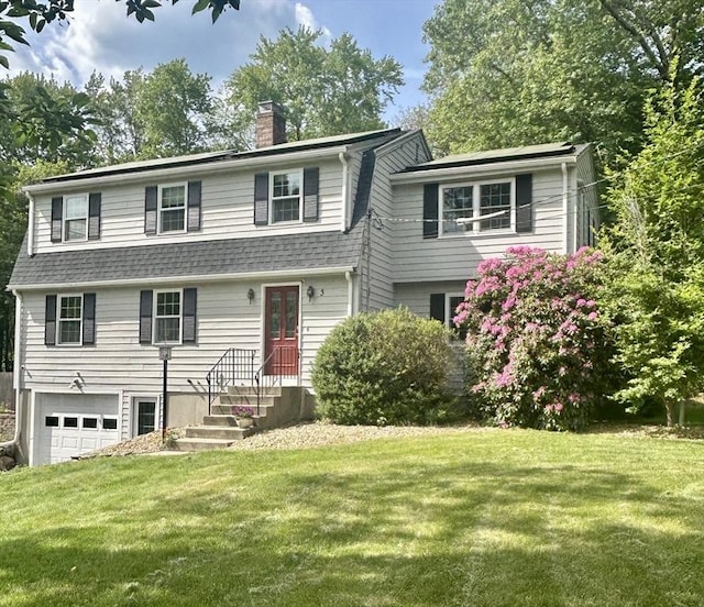 3 Howe St, Medway, MA 02053 - view of front of house with an attached garage, a chimney, a front lawn, and a shingled roof