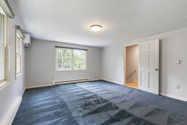 3 Howe St, Medway, MA 02053 - carpeted empty room with a baseboard heating unit, a wall mounted air conditioner, and baseboards