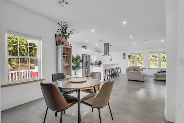 dining room featuring plenty of natural light