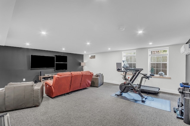 exercise area with carpet flooring and a wall mounted air conditioner