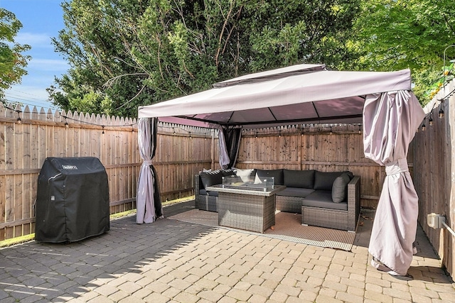 view of patio / terrace with a grill, a gazebo, and outdoor lounge area