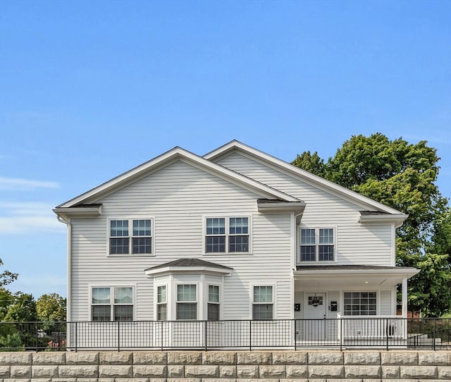 view of side of property with a porch