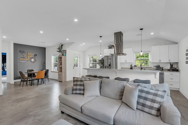 living room with lofted ceiling and light hardwood / wood-style floors