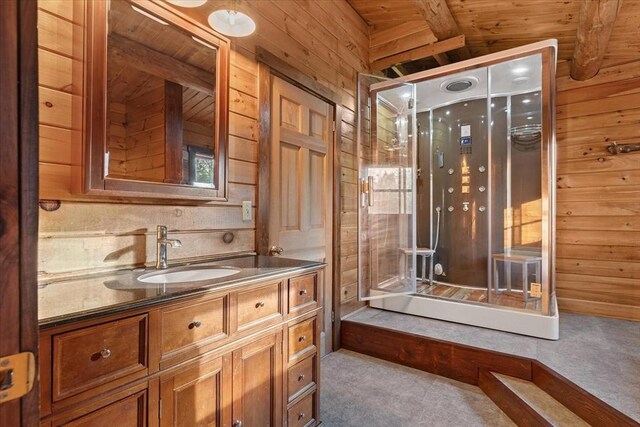 bathroom featuring vanity, vaulted ceiling with beams, wood walls, and wood ceiling