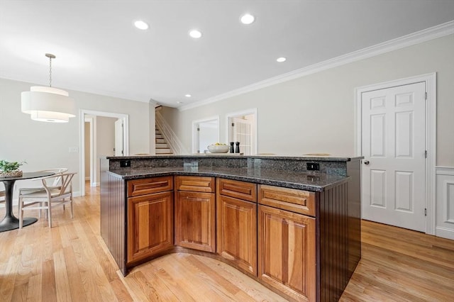 17 Arrowhead Ln, Westborough, MA 01581 - kitchen with brown cabinetry, light wood-style flooring, crown molding, recessed lighting, and hanging light fixtures