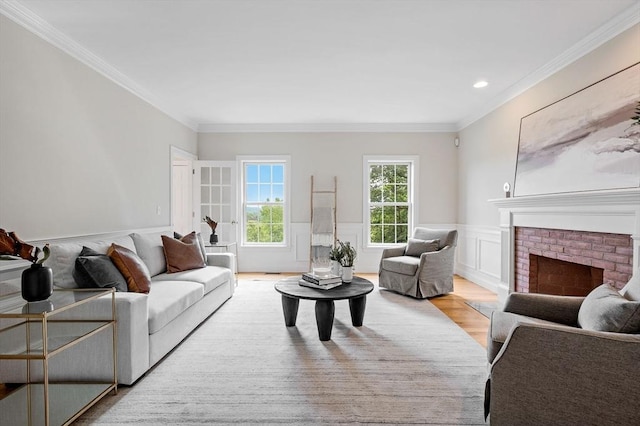 17 Arrowhead Ln, Westborough, MA 01581 - living area featuring crown molding, wood finished floors, wainscoting, a fireplace, and a decorative wall