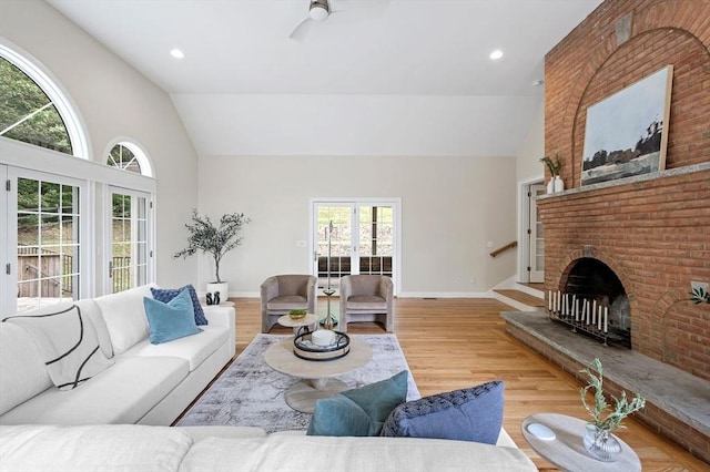 17 Arrowhead Ln, Westborough, MA 01581 - living room featuring high vaulted ceiling, a fireplace, wood finished floors, and recessed lighting