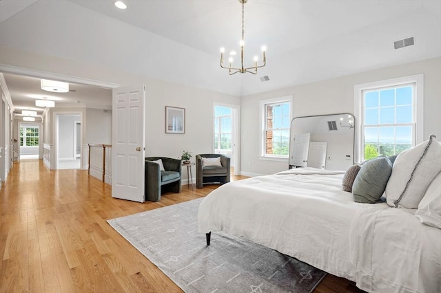17 Arrowhead Ln, Westborough, MA 01581 - bedroom with a chandelier and light wood-style flooring