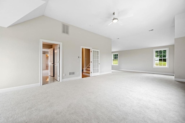 17 Arrowhead Ln, Westborough, MA 01581 - carpeted empty room with lofted ceiling, ceiling fan, and stairway