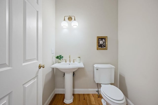 17 Arrowhead Ln, Westborough, MA 01581 - half bathroom with toilet and wood finished floors