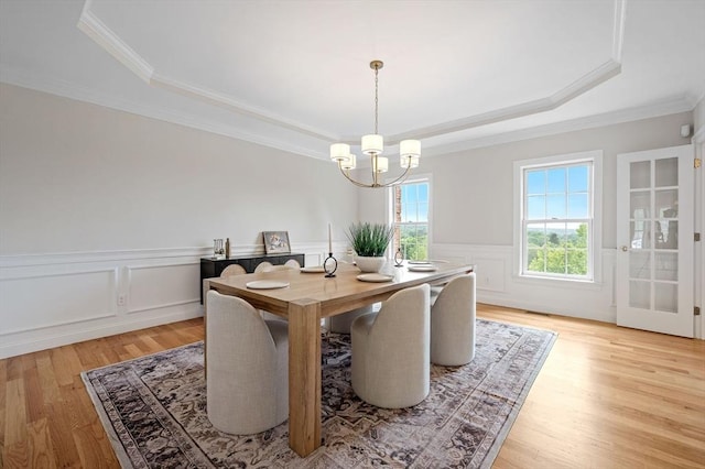 17 Arrowhead Ln, Westborough, MA 01581 - dining space featuring a raised ceiling, a chandelier, crown molding, light wood-type flooring, and a wainscoted wall