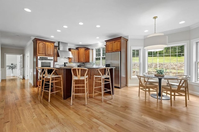 17 Arrowhead Ln, Westborough, MA 01581 - kitchen featuring wall chimney exhaust hood, appliances with stainless steel finishes, crown molding, recessed lighting, and brown cabinets