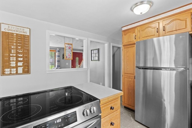 kitchen with appliances with stainless steel finishes and light countertops