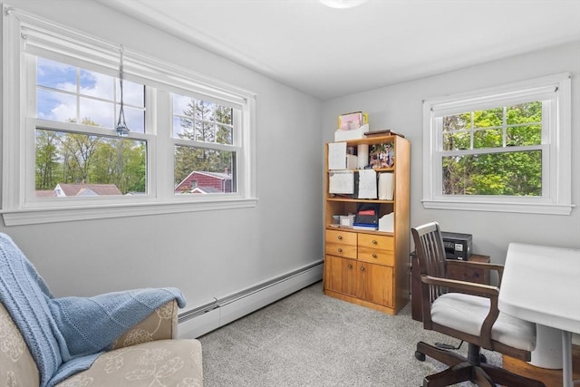 carpeted office space featuring baseboard heating and plenty of natural light