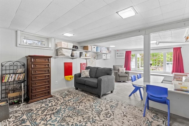 living area featuring a wall mounted AC