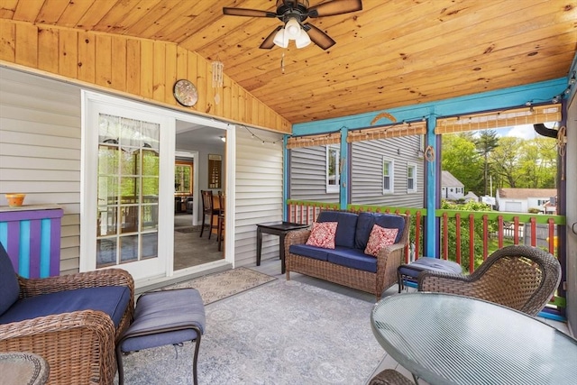 sunroom with vaulted ceiling, a ceiling fan, outdoor lounge area, and plenty of natural light