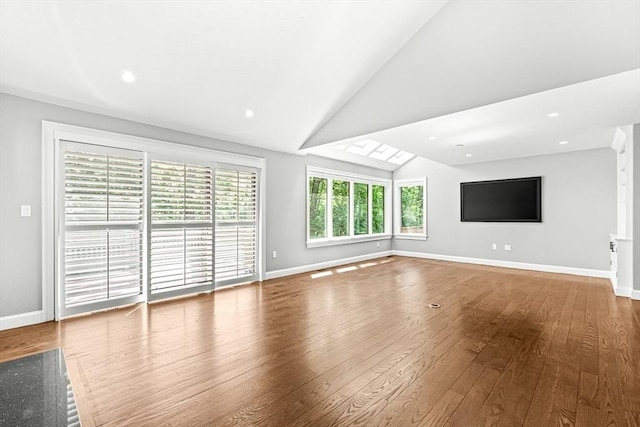 7 Wainwright Rd Unit 55, Winchester, MA 01890 - unfurnished living room with lofted ceiling, wood finished floors, baseboards, and recessed lighting