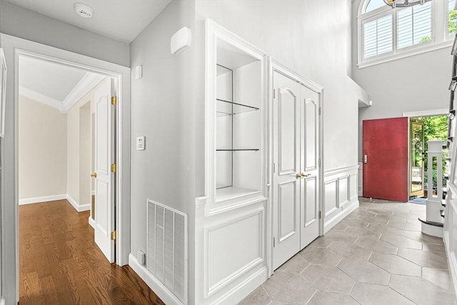 7 Wainwright Rd Unit 55, Winchester, MA 01890 - corridor with ornamental molding and baseboards