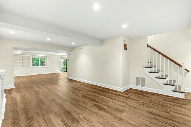 7 Wainwright Rd Unit 55, Winchester, MA 01890 - unfurnished living room with wood finished floors, recessed lighting, baseboards, and stairway