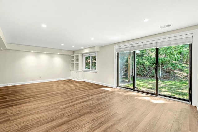 7 Wainwright Rd Unit 55, Winchester, MA 01890 - spare room featuring baseboards, wood finished floors, and recessed lighting
