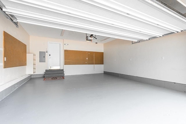 7 Wainwright Rd Unit 55, Winchester, MA 01890 - garage with electric panel and a garage door opener