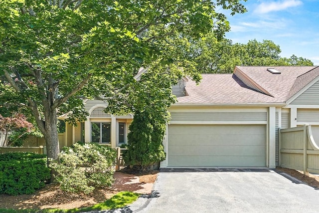 7 Wainwright Rd Unit 55, Winchester, MA 01890 - view of front of property with a garage, driveway, and a shingled roof