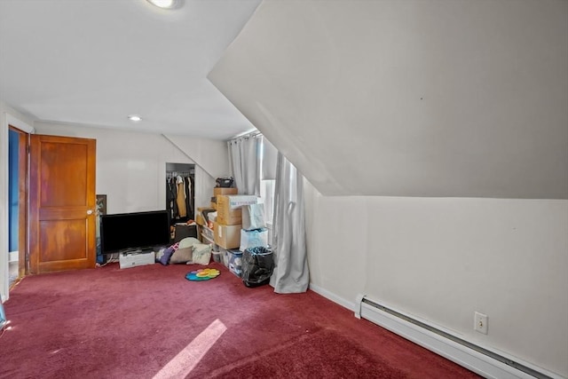 bonus room with vaulted ceiling, baseboard heating, and carpet flooring