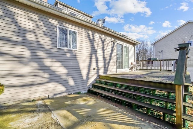 wooden terrace with a patio