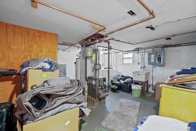 basement featuring washer / dryer, electric panel, and sink