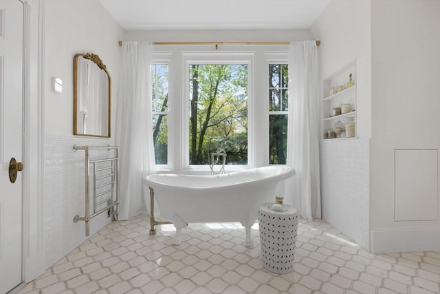 full bathroom featuring a soaking tub