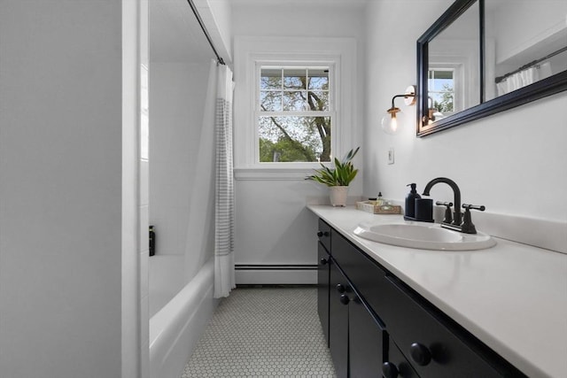 bathroom with a baseboard heating unit, vanity, and shower / bath combination with curtain