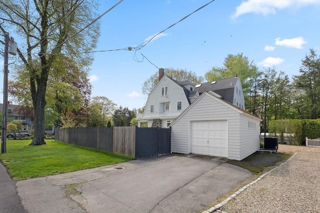 detached garage featuring driveway