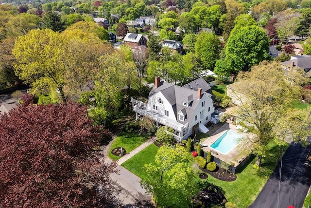 view of subject property featuring a pool