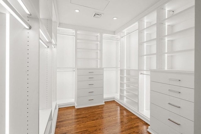 walk in closet with wood finished floors and visible vents