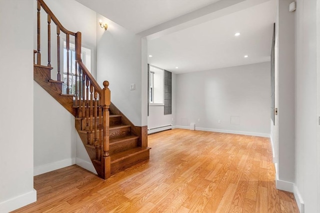 entrance foyer with baseboards, stairs, baseboard heating, recessed lighting, and light wood-style floors