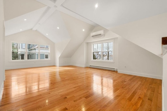 bonus room featuring light wood finished floors, a healthy amount of sunlight, a baseboard heating unit, and a wall unit AC