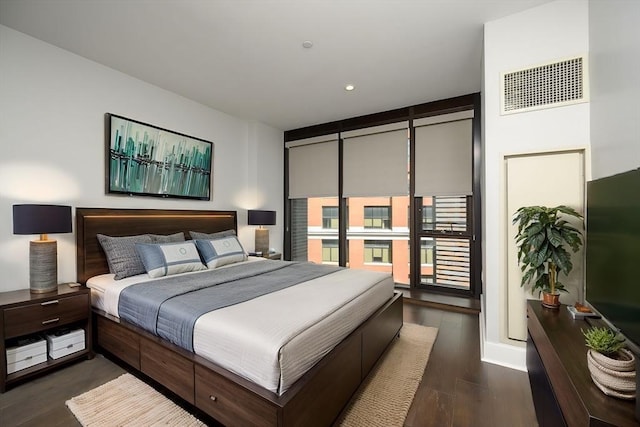 bedroom featuring visible vents, recessed lighting, and dark wood-style flooring