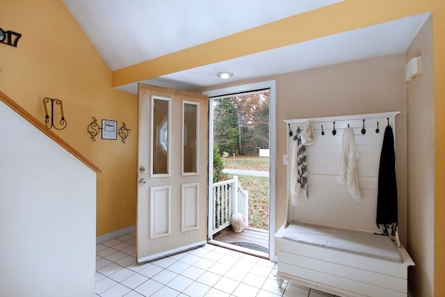 interior space featuring lofted ceiling and light tile patterned floors